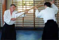 Foster Sensei teaching Aiki-jo at
                                the Institute of Aikido Summer School