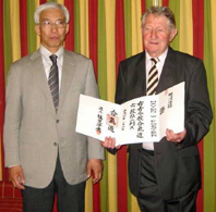 Foster Sensei with the Doshu and
                                his 6th dan certificate