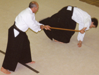 Ron Russell Sensei
                                            throwing with the Jo.